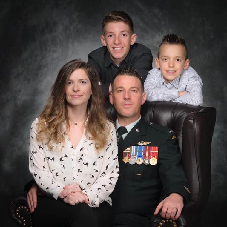 Dwayne Desveaux in Canadian Armed Forces dress uniform with his wife Mallory and their two sons
